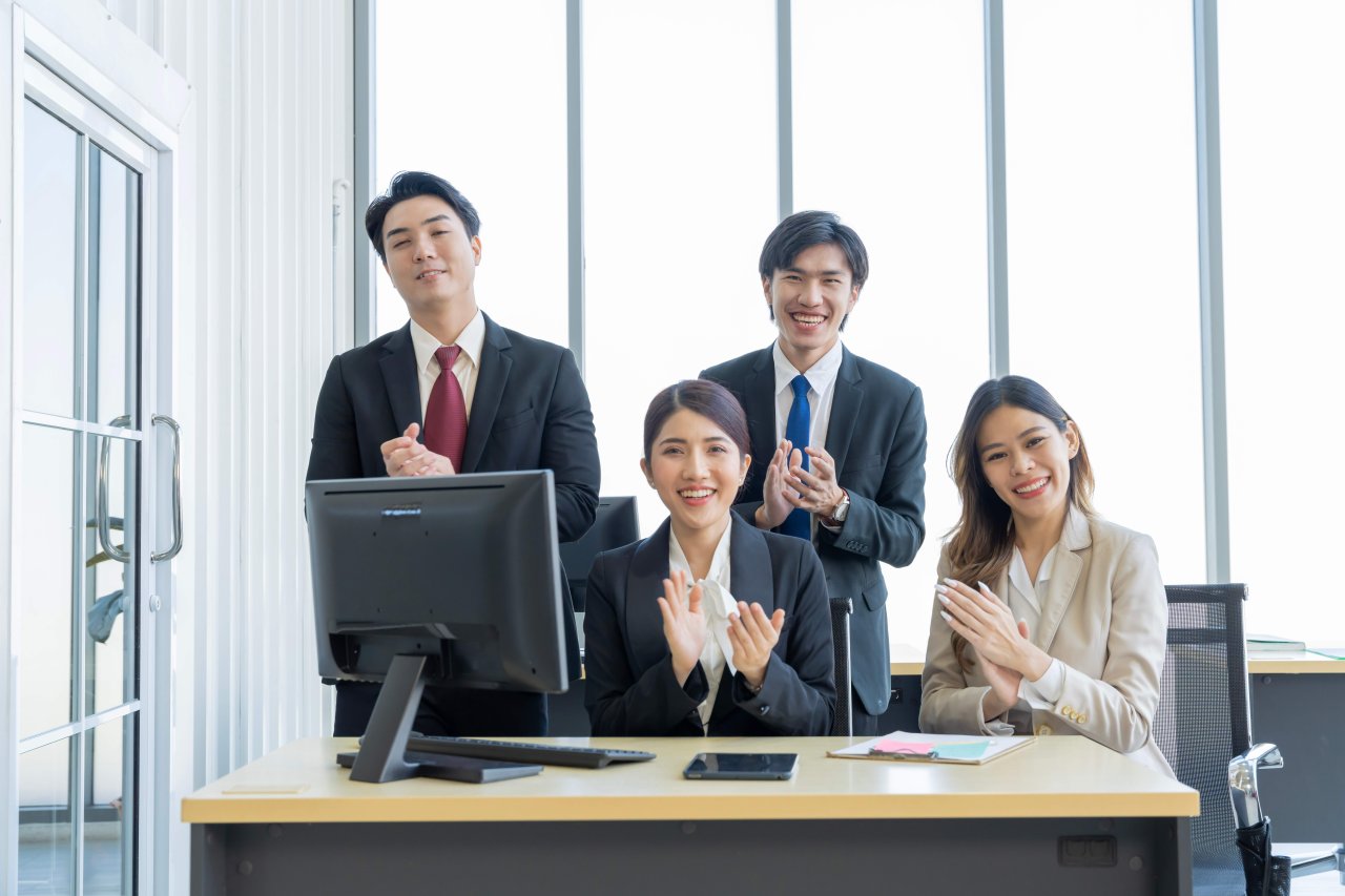 Japanese business professionals discussing in an office