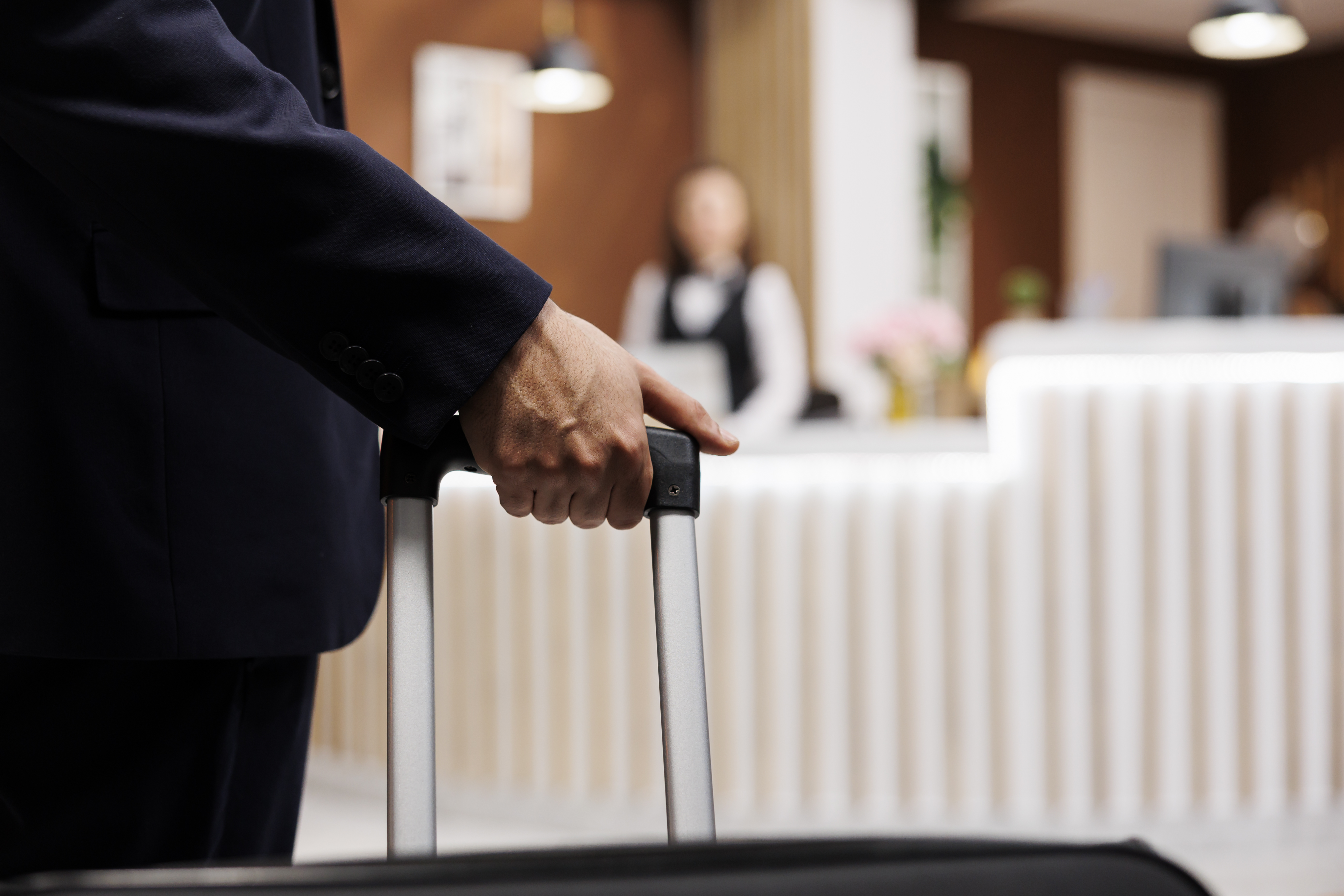 Hotel guest arriving at reception for a hospitality communication scenario